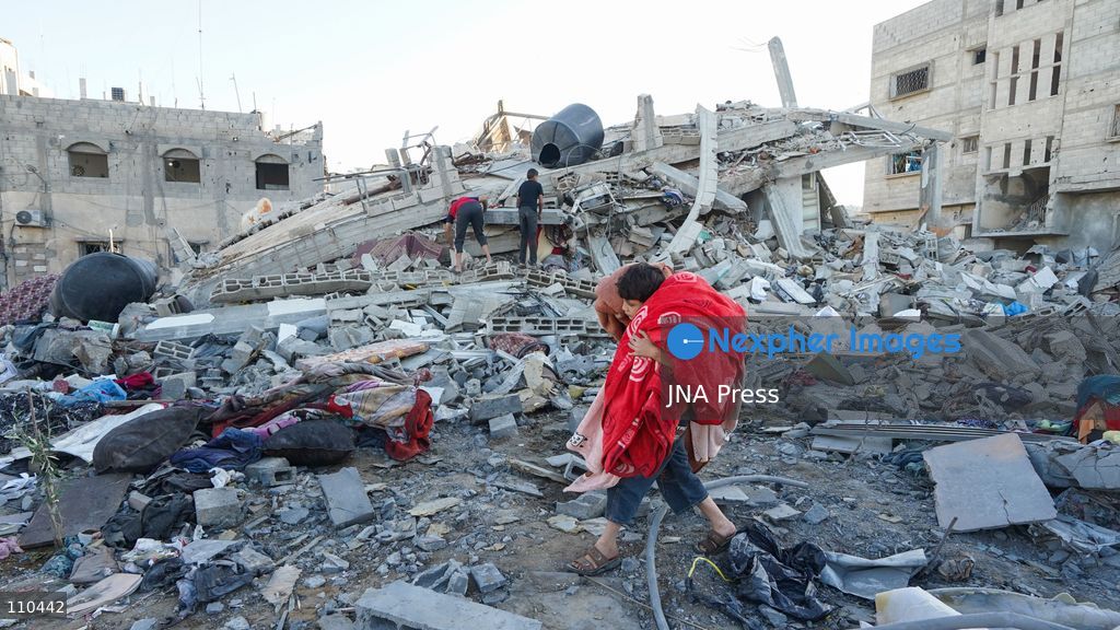 BUREIJ REFUGEE CAMP, PALESTINE, OCTOBER 30, 2026: Rubble covers the site of the al-Qarinawi family’s home following an Israeli airstrike in Bureij refugee camp in the central Gaza Strip. The strike on October 29 destroyed the residential building and caused extensive damage to surrounding homes. (Photo by Ramzi Abu Amer/JNA Press via Nexpher Images)