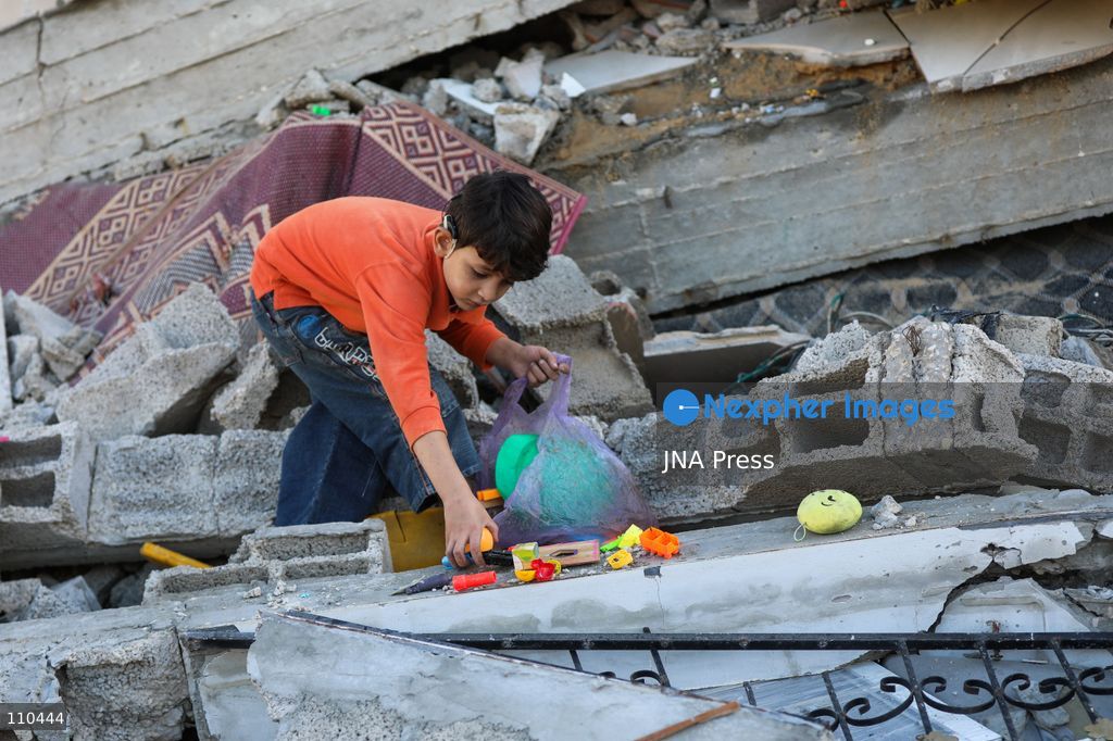 BUREIJ REFUGEE CAMP, PALESTINE, OCTOBER 30, 2026: Rubble covers the site of the al-Qarinawi family’s home following an Israeli airstrike in Bureij refugee camp in the central Gaza Strip. The strike on October 29 destroyed the residential building and caused extensive damage to surrounding homes. (Photo by Ramzi Abu Amer/JNA Press via Nexpher Images)