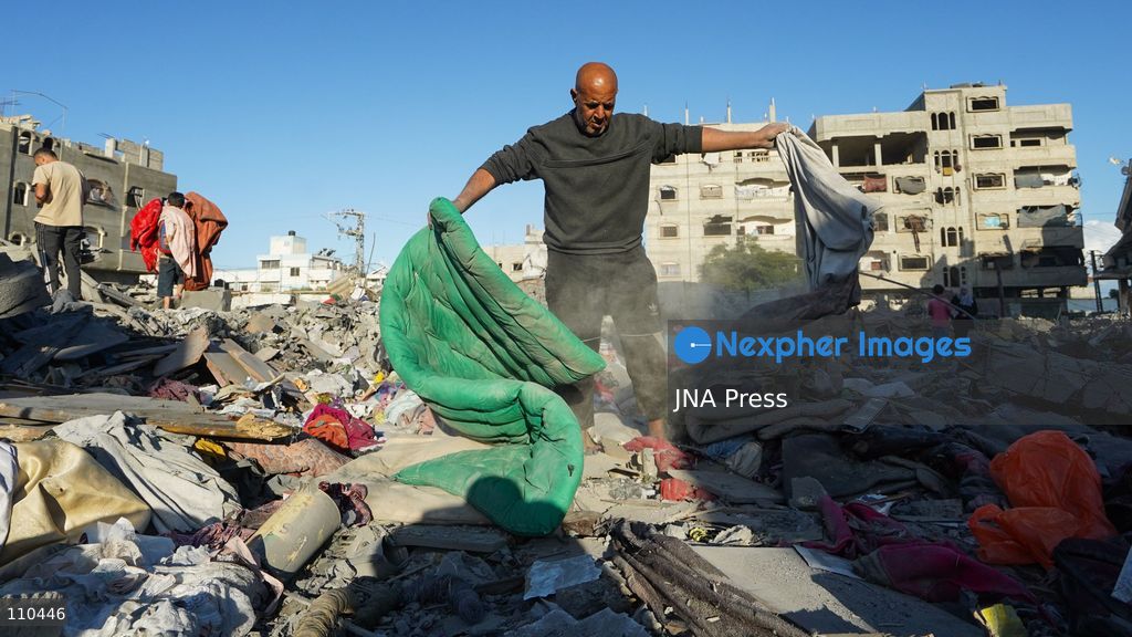 BUREIJ REFUGEE CAMP, PALESTINE, OCTOBER 30, 2026: Rubble covers the site of the al-Qarinawi family’s home following an Israeli airstrike in Bureij refugee camp in the central Gaza Strip. The strike on October 29 destroyed the residential building and caused extensive damage to surrounding homes. (Photo by Ramzi Abu Amer/JNA Press via Nexpher Images)