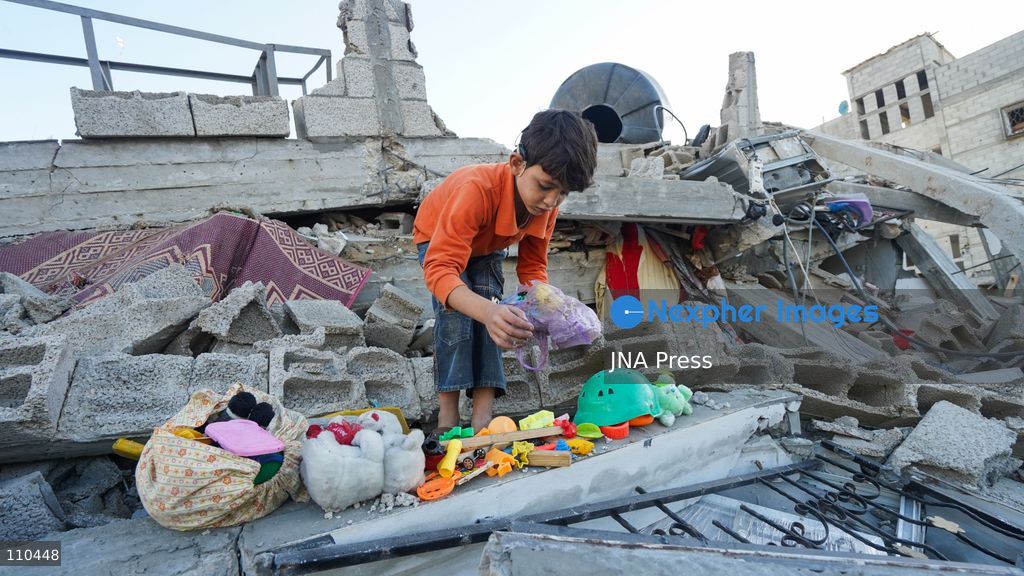 BUREIJ REFUGEE CAMP, PALESTINE, OCTOBER 30, 2026: Rubble covers the site of the al-Qarinawi family’s home following an Israeli airstrike in Bureij refugee camp in the central Gaza Strip. The strike on October 29 destroyed the residential building and caused extensive damage to surrounding homes. (Photo by Ramzi Abu Amer/JNA Press via Nexpher Images)