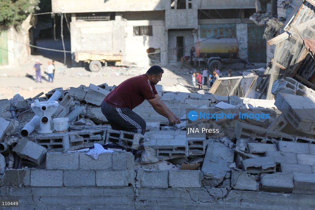 BUREIJ REFUGEE CAMP, PALESTINE, OCTOBER 30, 2026: Rubble covers the site of the al-Qarinawi family’s home following an Israeli airstrike in Bureij refugee camp in the central Gaza Strip. The strike on October 29 destroyed the residential building and caused extensive damage to surrounding homes. (Photo by Ramzi Abu Amer/JNA Press via Nexpher Images)