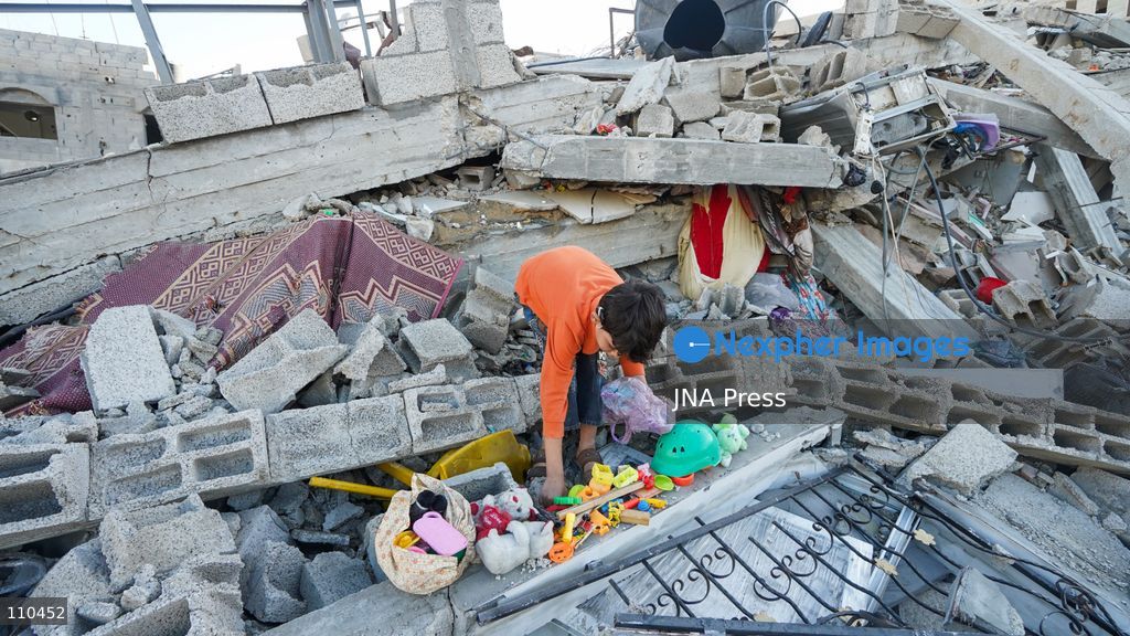 BUREIJ REFUGEE CAMP, PALESTINE, OCTOBER 30, 2026: Rubble covers the site of the al-Qarinawi family’s home following an Israeli airstrike in Bureij refugee camp in the central Gaza Strip. The strike on October 29 destroyed the residential building and caused extensive damage to surrounding homes. (Photo by Ramzi Abu Amer/JNA Press via Nexpher Images)