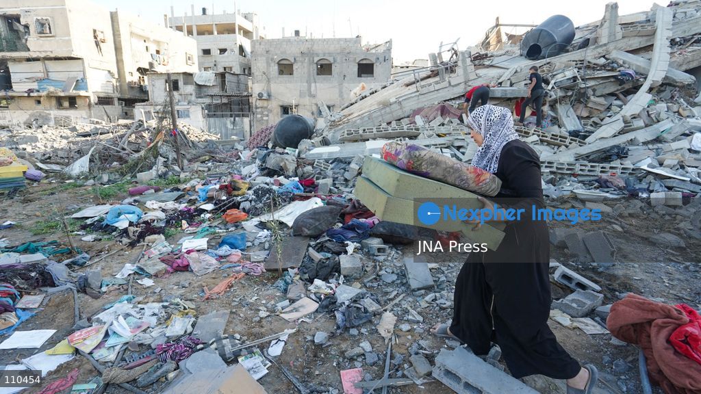 BUREIJ REFUGEE CAMP, PALESTINE, OCTOBER 30, 2026: Rubble covers the site of the al-Qarinawi family’s home following an Israeli airstrike in Bureij refugee camp in the central Gaza Strip. The strike on October 29 destroyed the residential building and caused extensive damage to surrounding homes. (Photo by Ramzi Abu Amer/JNA Press via Nexpher Images)