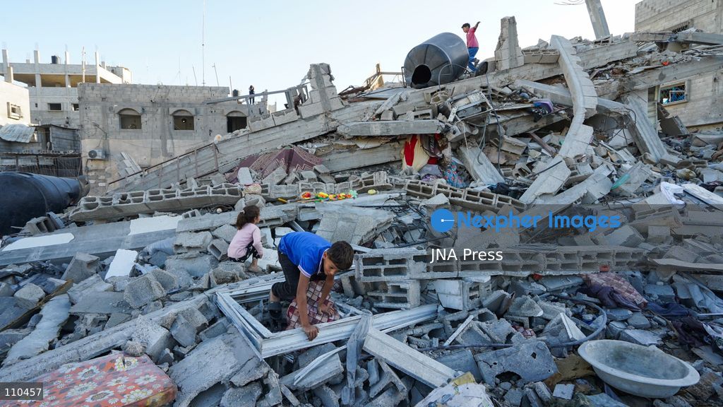 BUREIJ REFUGEE CAMP, PALESTINE, OCTOBER 30, 2026: Rubble covers the site of the al-Qarinawi family’s home following an Israeli airstrike in Bureij refugee camp in the central Gaza Strip. The strike on October 29 destroyed the residential building and caused extensive damage to surrounding homes. (Photo by Ramzi Abu Amer/JNA Press via Nexpher Images)
