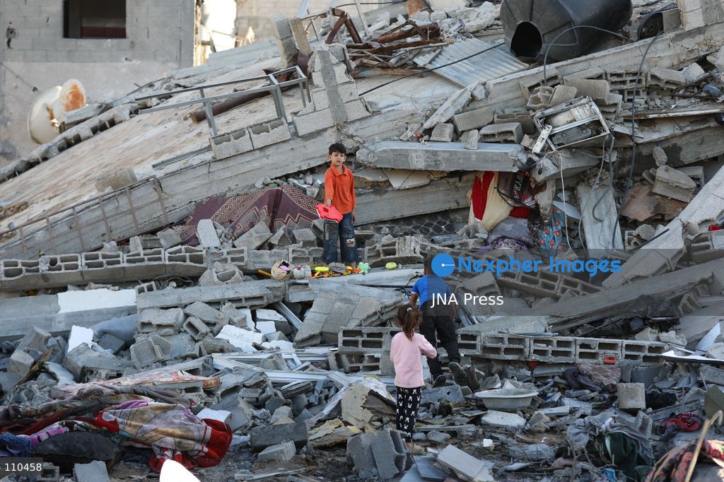 BUREIJ REFUGEE CAMP, PALESTINE, OCTOBER 30, 2026: Rubble covers the site of the al-Qarinawi family’s home following an Israeli airstrike in Bureij refugee camp in the central Gaza Strip. The strike on October 29 destroyed the residential building and caused extensive damage to surrounding homes. (Photo by Ramzi Abu Amer/JNA Press via Nexpher Images)