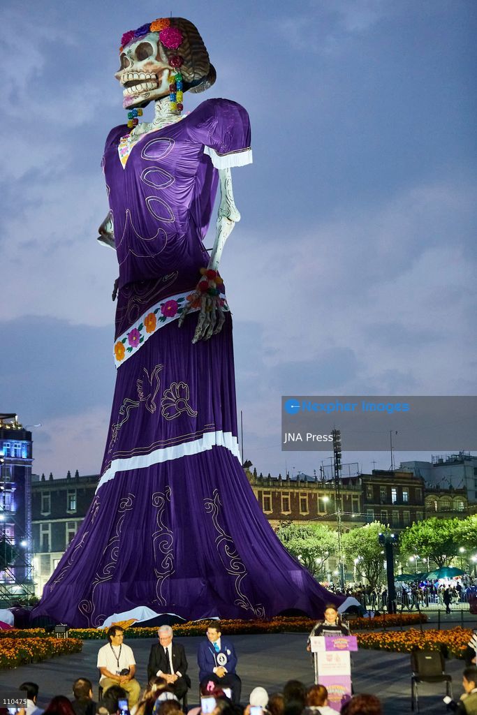 MEXICO CITY, MEXICO - OCTOBER 29, 2026: A massive catrina sculpture stands in the Zócalo plaza ahead of Day of the Dead festivities. Organizers state the 33-meter installation has set a Guinness World Record for the tallest catrina, alongside traditional "ofrendas" and decorative lighting. (Photo by Juan Perez Puente/JNA Press via Nexpher Images)