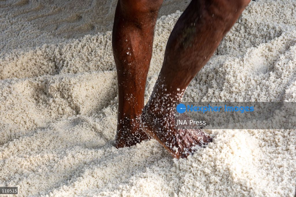 CHATTOGRAM, BANGLADESH - OCTOBER 30, 2026: Workers harvest salt from evaporation ponds lined with black polyethylene sheeting, scooping crystallized salt into mounds and carrying it in woven bamboo baskets. Seawater is held in the ponds and evaporated by sunlight over two to three days before harvesting. (Photo by Sohel Chowdhury/JNA Press via Nexpher Images)