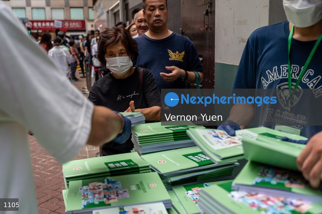 Hong Kong People lIne Up for copies of the 2024 Policy Address