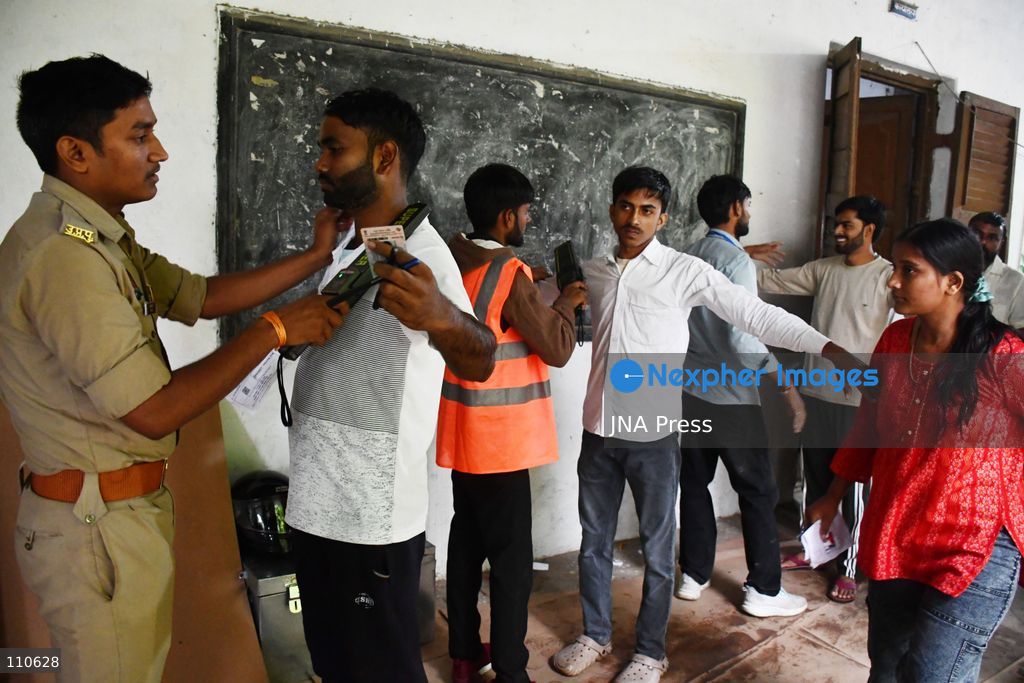 PRAYAGRAJ, INDIA - OCTOBER 30, 2026: Candidates undergo security checks and document verification before entering the examination centre to appear for the Uttar Pradesh Subordinate Services Selection Commission (UPSSSC) Preliminary Eligibility Test (PET), a state-level screening for government jobs, in Prayagraj. (Photo by Saurabh Kumar/JNA Press via Nexpher Images)