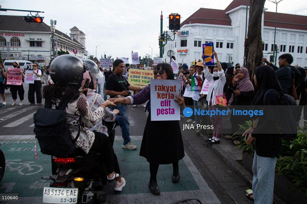 YOGYAKARTA, INDONESIA - OCTOBER 30, 2026: Members of the "Ibu Berisik" community staged a protest at the Zero Kilometer Marker in Yogyakarta, calling on the government to handle natural disasters with transparency and prioritize public safety, economic stability and basic needs. Protesters also demanded an end to division and guaranteed legal protection for citizens exercising freedom of expression. (Photo by Topen Anggara Saputra/JNA Press via Nexpher Images)