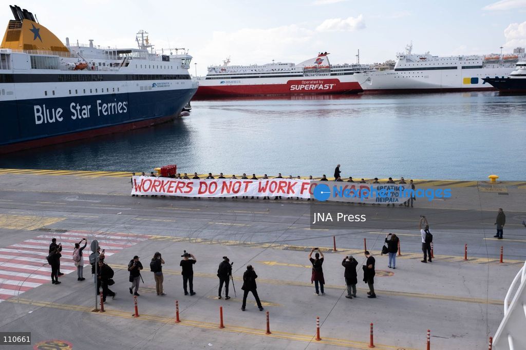 PIRAEUS, GREECE - OCTOBER 30, 2026: Dockworkers, seafarers and trade union members take part in a demonstration at the port of Piraeus during an international day of action involving 113 ports across 22 countries. The strike opposes arms shipments to conflict zones and calls for improved working conditions, better wages and workplace safety. (Photo by Antonis Zouridakis/JNA Press via Nexpher Images)