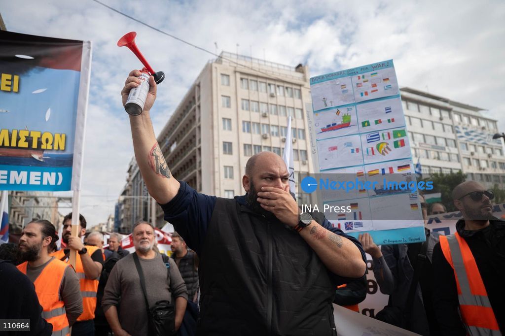 PIRAEUS, GREECE - OCTOBER 30, 2026: Dockworkers, seafarers and trade union members take part in a demonstration at the port of Piraeus during an international day of action involving 113 ports across 22 countries. The strike opposes arms shipments to conflict zones and calls for improved working conditions, better wages and workplace safety. (Photo by Antonis Zouridakis/JNA Press via Nexpher Images)