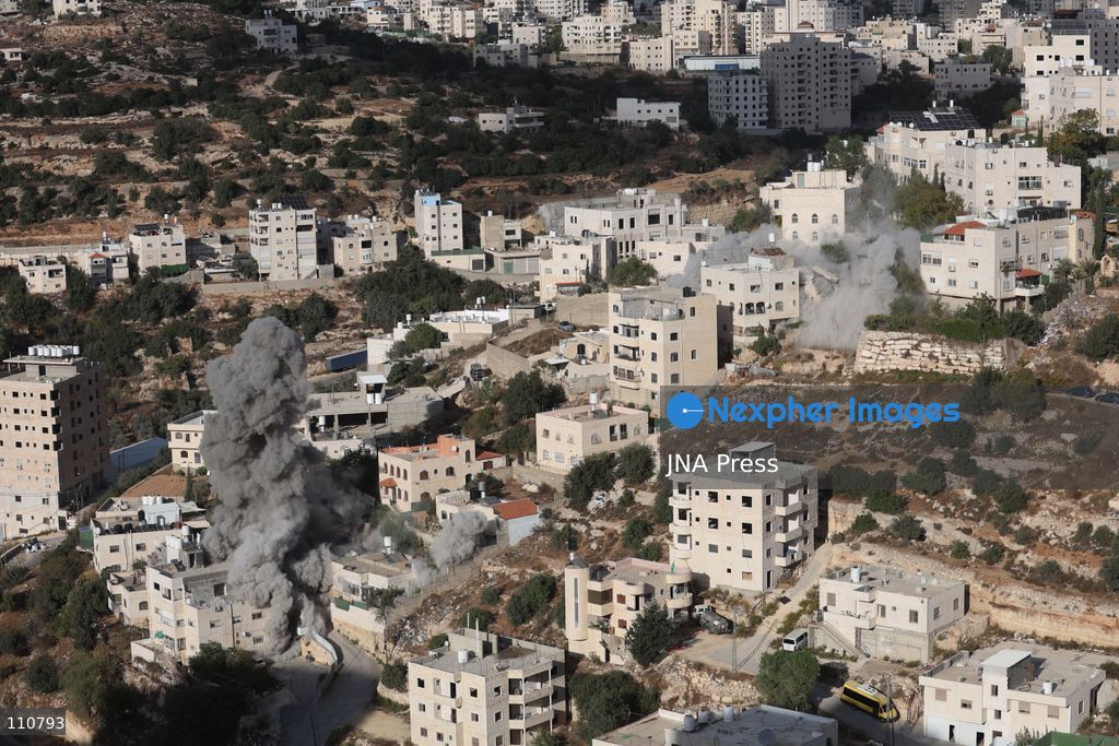 HEBRON, PALESTINE, OCTOBER 30, 2026: Israeli forces demolish the family homes of Ahmad and Hamouda al-Jaaba in Hebron, in the occupied West Bank. The two Palestinians are accused of carrying out an October 23 shooting attack near the Farsh al-Hawa entrance to the city that killed two Israeli soldiers and wounded others. (Photo by Mosab shawer/JNA Press via Nexpher Images)