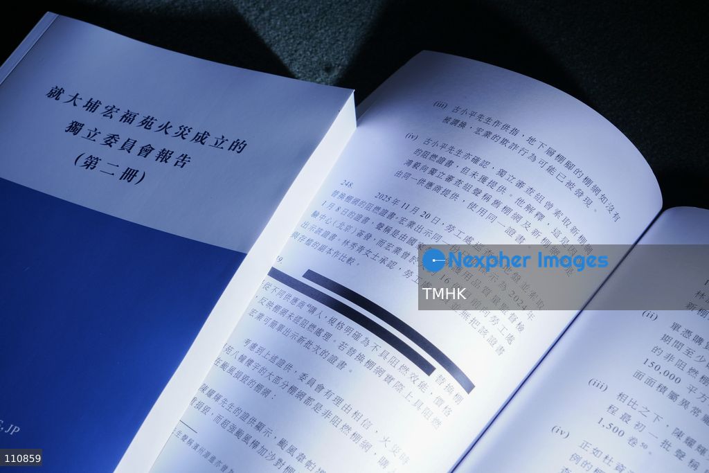 A Chinese-language hard copy of the Independent Committee's report on the Wang Fuk Court fire in Tai Po, showing the cover alongside partially redacted inner pages, is displayed at the Central Government Offices in Hong Kong on October 29, 2026. The report examines the causes of the deadly fire, regulatory shortcomings and recommendations to prevent similar tragedies. (Photo by Zulu Lo/TMHK via Nexpher Images)