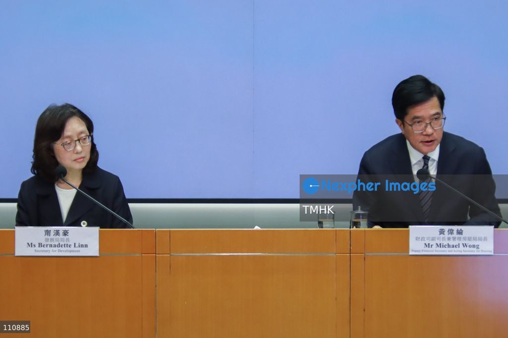 Hong Kong Deputy Financial Secretary and Acting Secretary for Housing Michael Wong Wai-lun and Secretary for Development Bernadette Linn Hon-ho attend a press conference on reforms to building maintenance and renovation regulations in Hong Kong on October 30, 2026. The government outlines measures to strengthen regulatory oversight and support property owners following the deadly Wang Fuk Court fire. (Photo by Gordon Choi/TMHK via Nexpher Images)