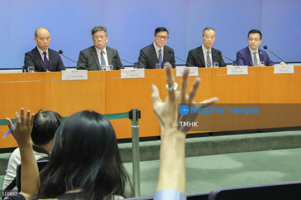 Journalists raise their hands to ask questions as Hong Kong Secretary for Security Chris Tang Ping-keung, Secretary for Commerce and Economic Development Algernon Yau Ying-wah, Deputy Commissioner of Police (Operations) Keith Yip Wan-lung, ICAC Director of Investigation Choi Shu-keung and Competition Commission Chief Executive Officer Rasul Butt attend a press conference on measures to combat bid-rigging in building maintenance and renovation projects at the Central Government Offices in Hong Kong on October 30, 2026. (Photo by Gordon Choi/TMHK via Nexpher Images)