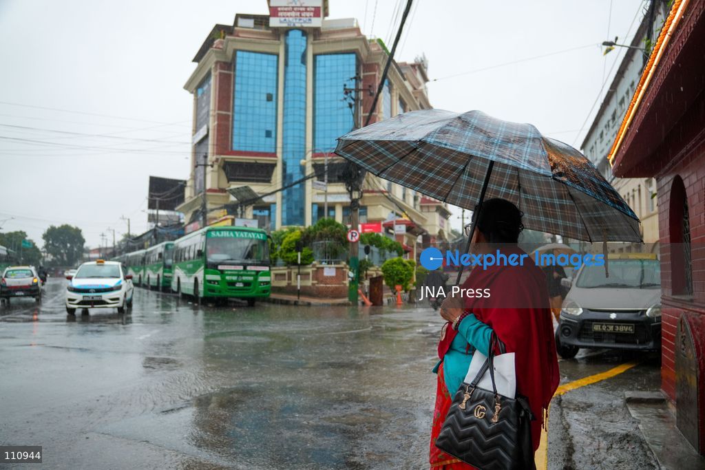 LALITPUR, NEPAL – OCTOBER 31, 2026: People walk through the rain in Lalitpur as Cyclone Arnab, which originated in the Bay of Bengal, brings rainfall to the Kathmandu Valley. Nepal's National Disaster Risk Reduction and Management Authority (NDRRMA) issued a high-alert advisory for 29 to 31 October, urging people to remain on high alert. (Photo by Sunil Pradhan/JNA Press via Nexpher Images)