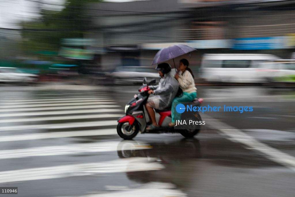 LALITPUR, NEPAL – OCTOBER 31, 2026: People walk through the rain in Lalitpur as Cyclone Arnab, which originated in the Bay of Bengal, brings rainfall to the Kathmandu Valley. Nepal's National Disaster Risk Reduction and Management Authority (NDRRMA) issued a high-alert advisory for 29 to 31 October, urging people to remain on high alert. (Photo by Sunil Pradhan/JNA Press via Nexpher Images)
