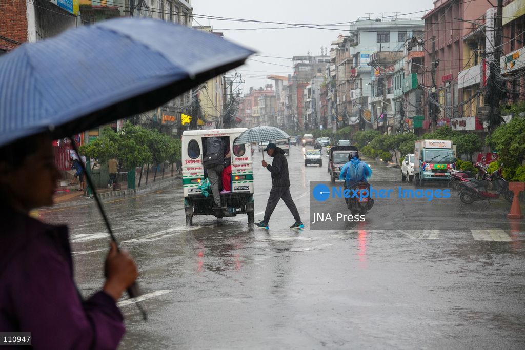 LALITPUR, NEPAL – OCTOBER 31, 2026: People walk through the rain in Lalitpur as Cyclone Arnab, which originated in the Bay of Bengal, brings rainfall to the Kathmandu Valley. Nepal's National Disaster Risk Reduction and Management Authority (NDRRMA) issued a high-alert advisory for 29 to 31 October, urging people to remain on high alert. (Photo by Sunil Pradhan/JNA Press via Nexpher Images)