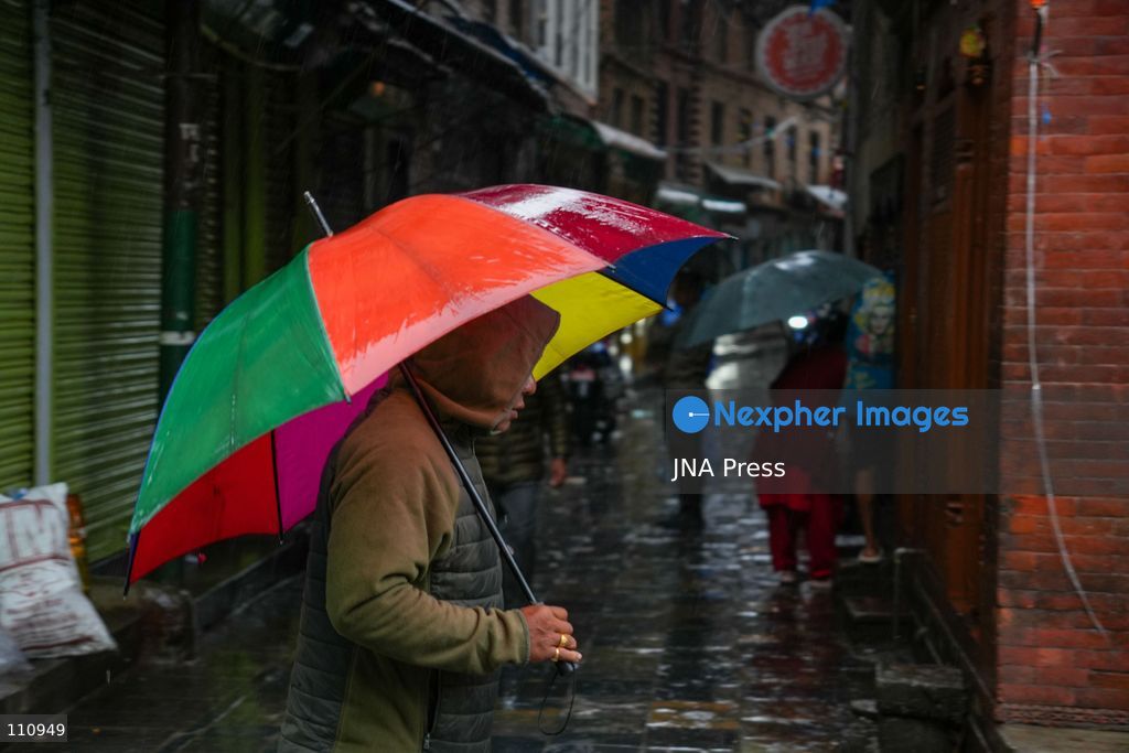 LALITPUR, NEPAL – OCTOBER 31, 2026: People walk through the rain in Lalitpur as Cyclone Arnab, which originated in the Bay of Bengal, brings rainfall to the Kathmandu Valley. Nepal's National Disaster Risk Reduction and Management Authority (NDRRMA) issued a high-alert advisory for 29 to 31 October, urging people to remain on high alert. (Photo by Sunil Pradhan/JNA Press via Nexpher Images)