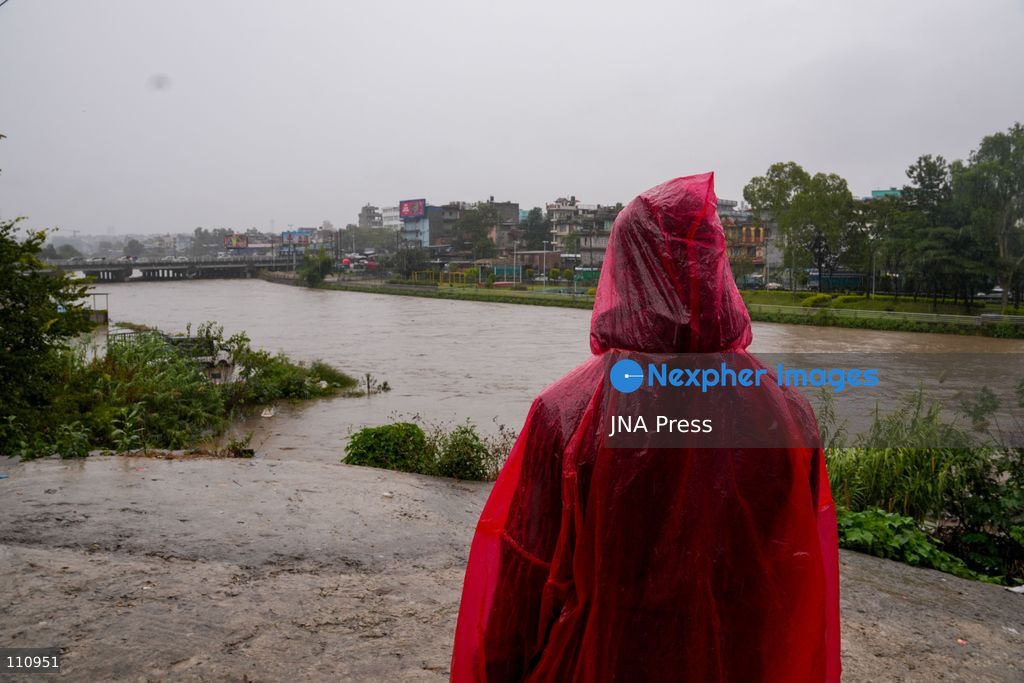 LALITPUR, NEPAL – OCTOBER 31, 2026: People walk through the rain in Lalitpur as Cyclone Arnab, which originated in the Bay of Bengal, brings rainfall to the Kathmandu Valley. Nepal's National Disaster Risk Reduction and Management Authority (NDRRMA) issued a high-alert advisory for 29 to 31 October, urging people to remain on high alert. (Photo by Sunil Pradhan/JNA Press via Nexpher Images)