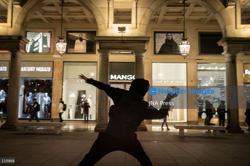 TURIN, ITALY - OCTOBER 30, 2026: Demonstrators march through central Turin during a protest that began at Piazza Castello at 6:00 p.m against rearmament. Clashes occurred on Via Roma where police officers used force against demonstrators. (Photo by Giulia Gorla/JNA Press via Nexpher Images)