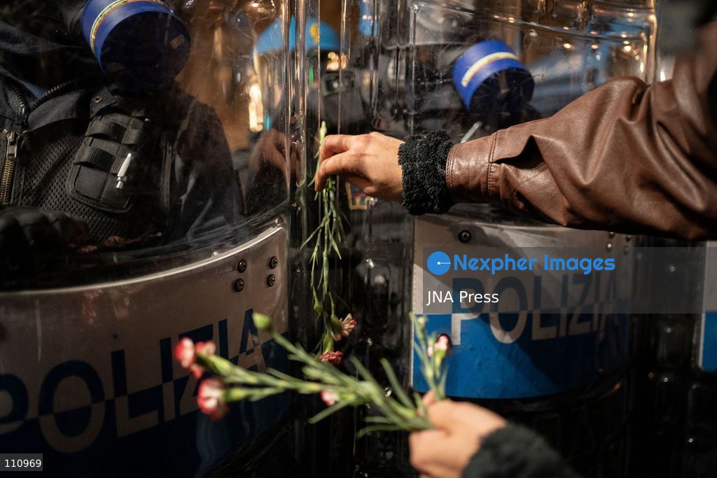 TURIN, ITALY - OCTOBER 30, 2026: Demonstrators march through central Turin during a protest that began at Piazza Castello at 6:00 p.m against rearmament. Clashes occurred on Via Roma where police officers used force against demonstrators. (Photo by Giulia Gorla/JNA Press via Nexpher Images)