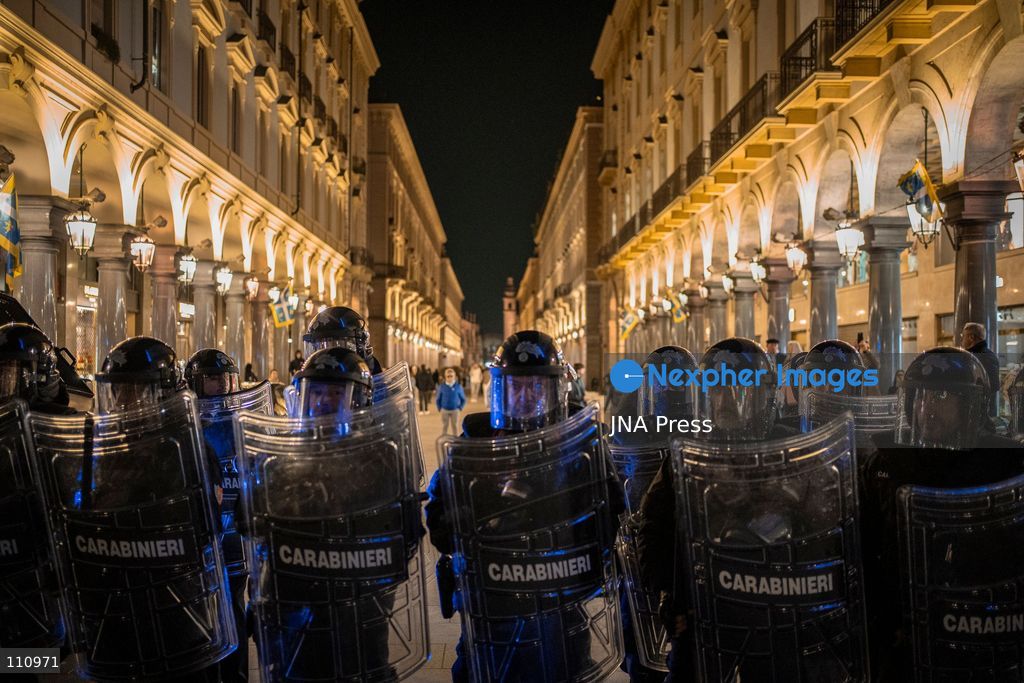 TURIN, ITALY - OCTOBER 30, 2026: Demonstrators march through central Turin during a protest that began at Piazza Castello at 6:00 p.m against rearmament. Clashes occurred on Via Roma where police officers used force against demonstrators. (Photo by Giulia Gorla/JNA Press via Nexpher Images)