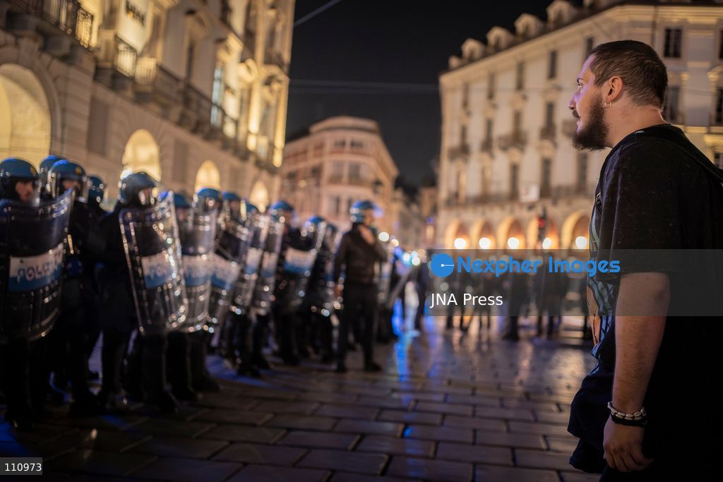 TURIN, ITALY - OCTOBER 30, 2026: Demonstrators march through central Turin during a protest that began at Piazza Castello at 6:00 p.m against rearmament. Clashes occurred on Via Roma where police officers used force against demonstrators. (Photo by Giulia Gorla/JNA Press via Nexpher Images)