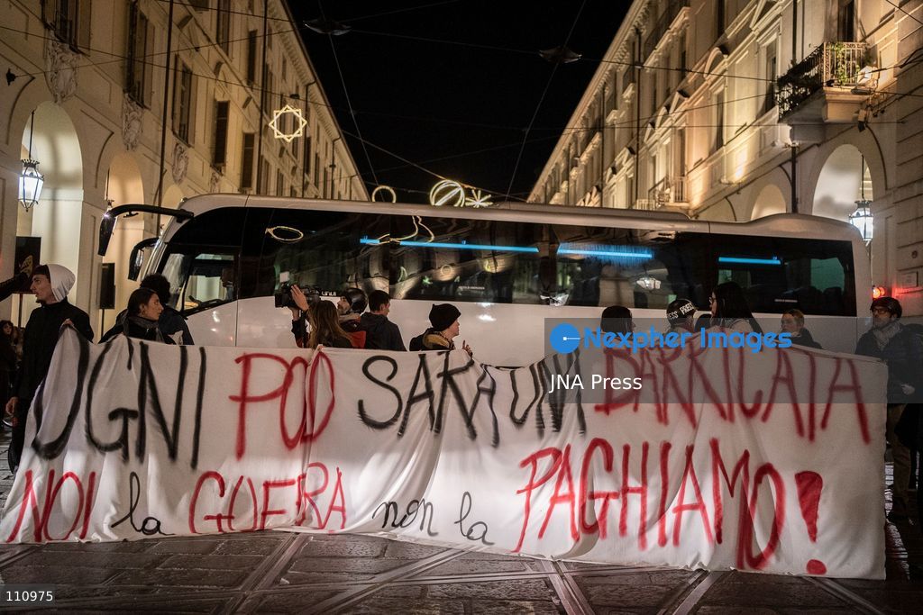 TURIN, ITALY - OCTOBER 30, 2026: Demonstrators march through central Turin during a protest that began at Piazza Castello at 6:00 p.m against rearmament. Clashes occurred on Via Roma where police officers used force against demonstrators. (Photo by Giulia Gorla/JNA Press via Nexpher Images)