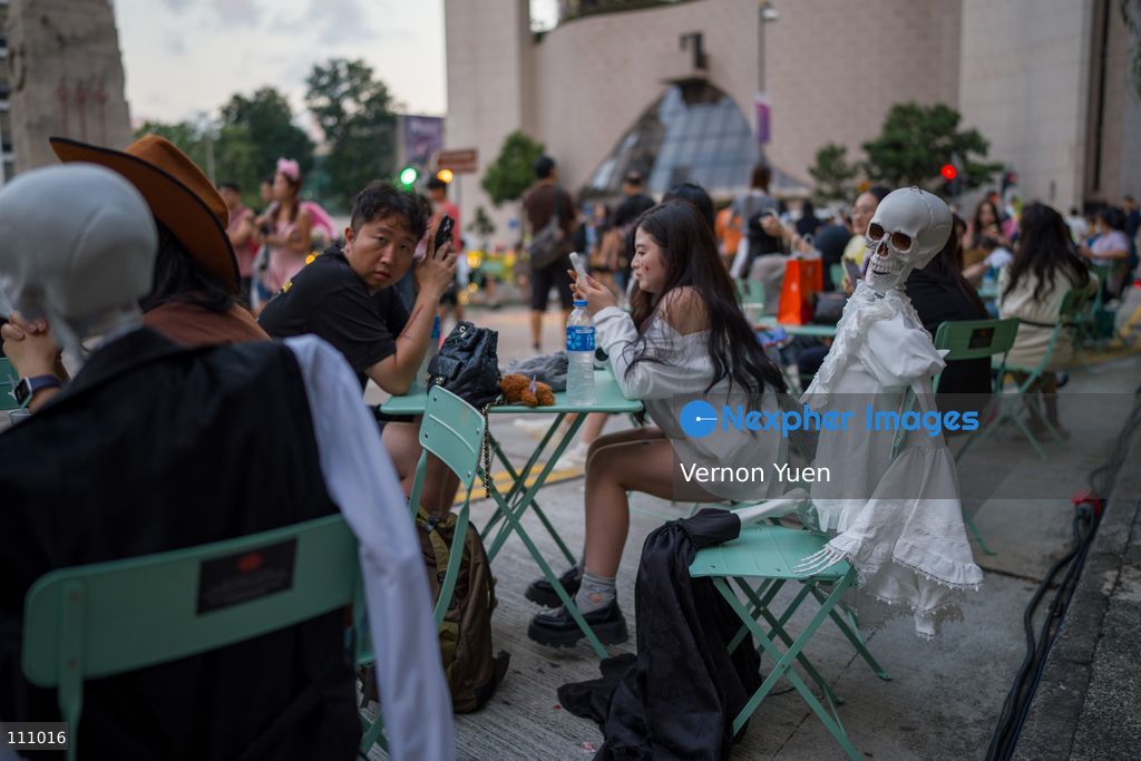 A plastic skelton sitting on a chair at a Halloween market in Central District on October 31, 2026 in Hong Kong. (Photo by Vernon Yuen/Nexpher Images)