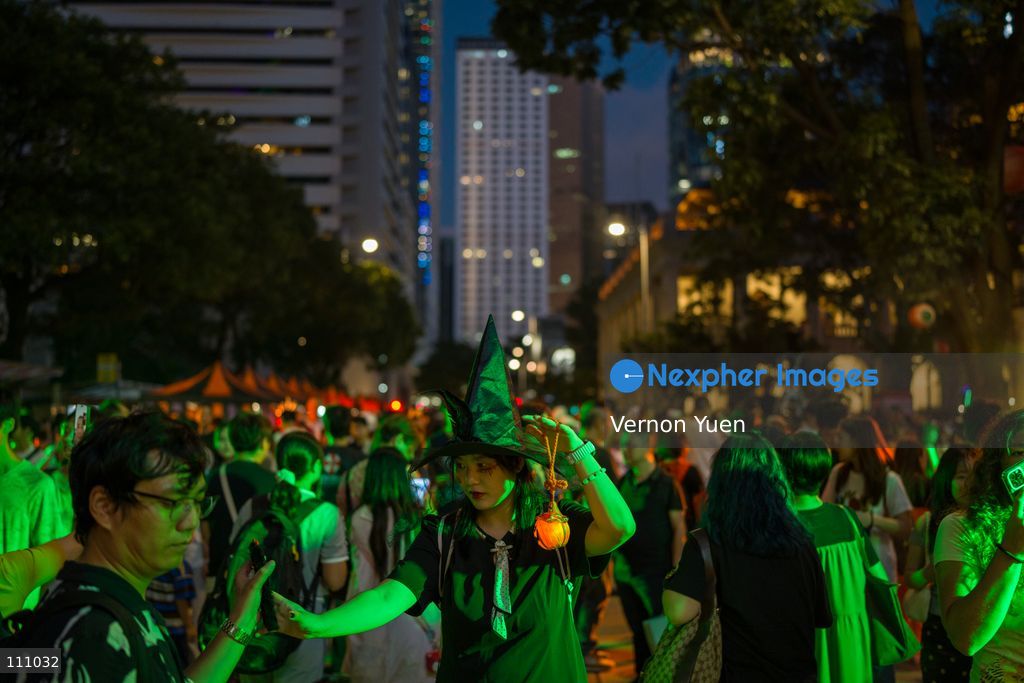People dress in costumes at a Halloween market in Central District on October 31, 2026 in Hong Kong. (Photo by Vernon Yuen/Nexpher Images)
