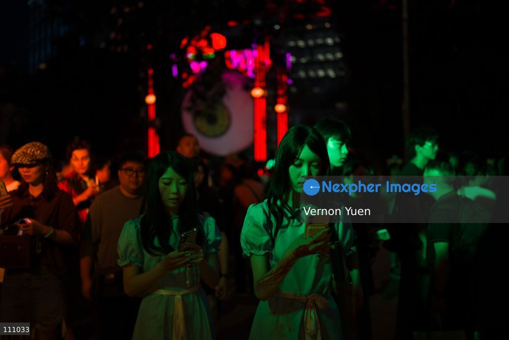 People dress in costumes at a Halloween market in Central District on October 31, 2026 in Hong Kong. (Photo by Vernon Yuen/Nexpher Images)