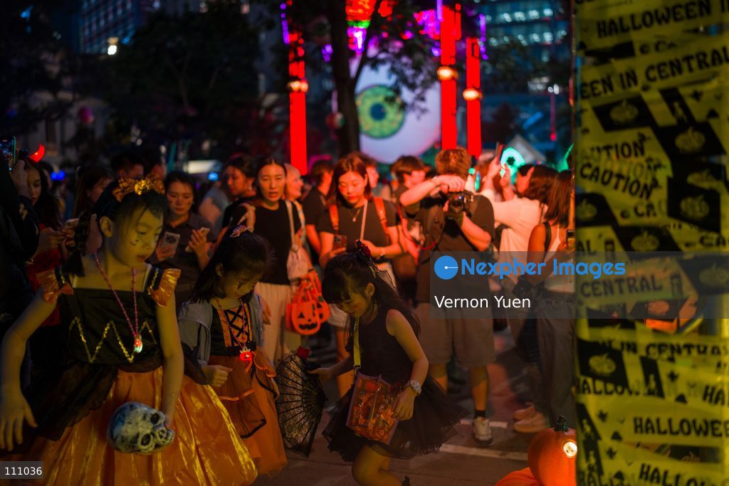 People dress in costumes at a Halloween market in Central District on October 31, 2026 in Hong Kong. (Photo by Vernon Yuen/Nexpher Images)