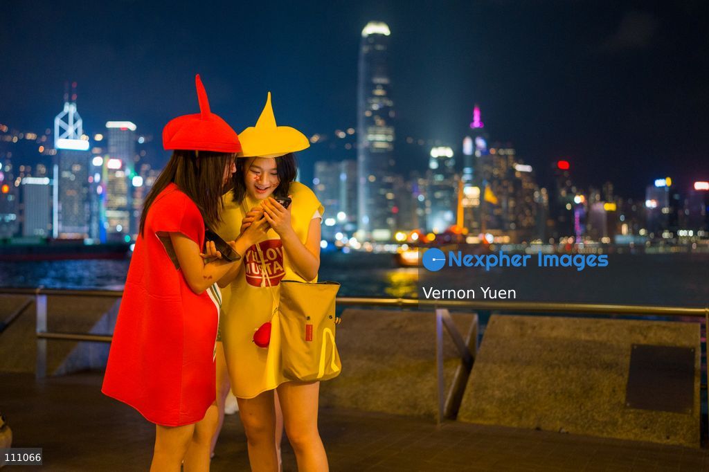 Two girls dress as condiments on October 31, 2026 in Hong Kong. (Photo by Vernon Yuen/Nexpher Images)