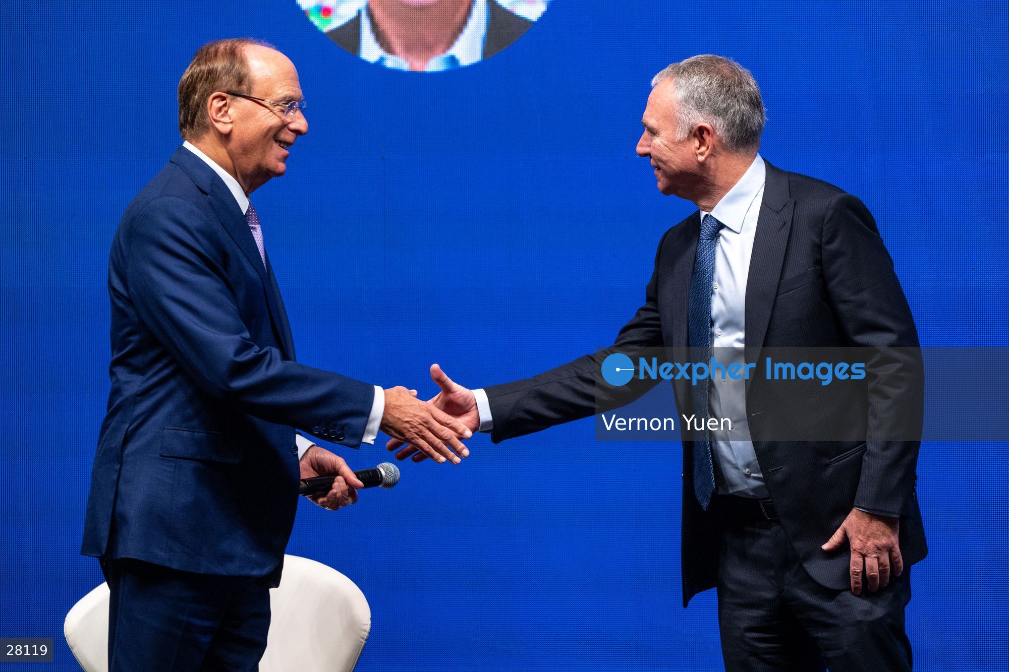Larry Fink, Chairman and CEO of BlackRock shaking hands with Ken... News  Photo - Nexpher Images