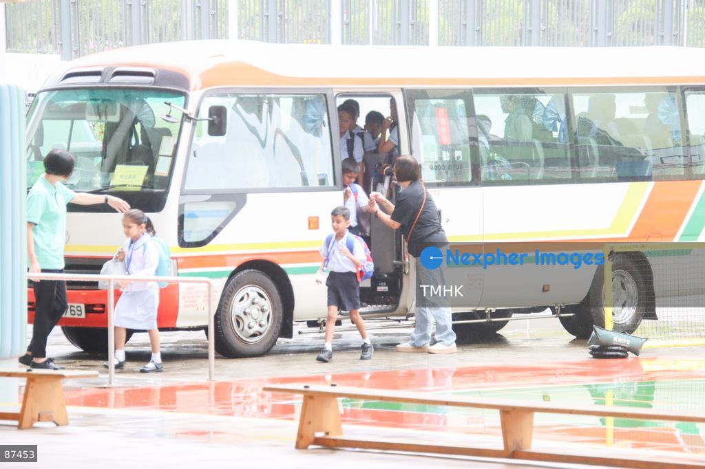 Students arrive on a school bus at the Hong Kong Taoist Association Wun Tsuen School on the first day of the new school year on September 1, 2026 in Hong Kong. (Photo by Gordon Choi/TMHK via Nexpher Images)