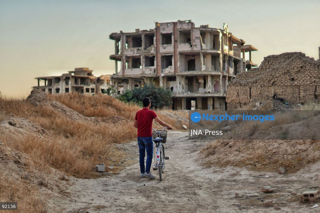 DAMASCUS, SYRIA, SEPTEMBER 14, 2026: Ahmet returns to the neighborhood where he grew up after spending 15 years in Turkey, having left Syria following the outbreak of conflict. On returning, he found much of his former neighborhood abandoned and heavily damaged. His journey reflects the experiences of Syrians returning to communities they left during years of conflict. Photo by Berke Arakli/ JNA Press. (Photo by Berke AraklÄ±/JNA Press via Nexpher Images)