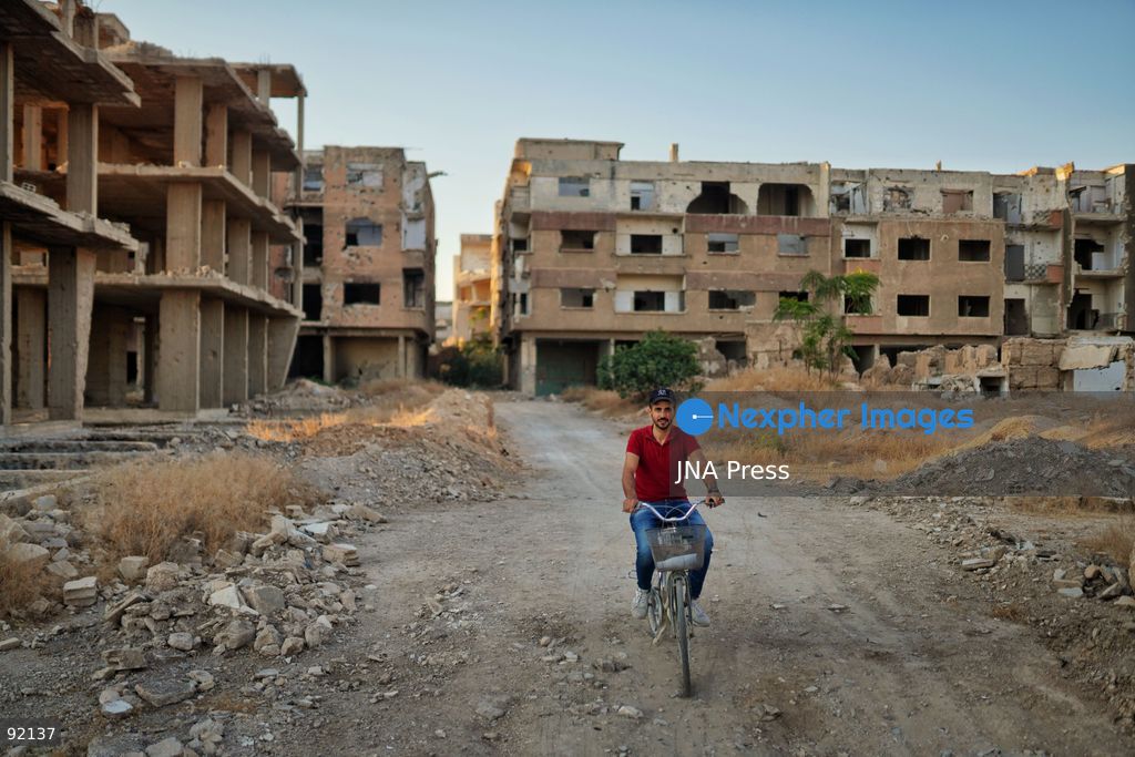 DAMASCUS, SYRIA, SEPTEMBER 14, 2026: Ahmet returns to the neighborhood where he grew up after spending 15 years in Turkey, having left Syria following the outbreak of conflict. On returning, he found much of his former neighborhood abandoned and heavily damaged. His journey reflects the experiences of Syrians returning to communities they left during years of conflict. Photo by Berke Arakli/ JNA Press. (Photo by Berke Araklı/JNA Press via Nexpher Images)