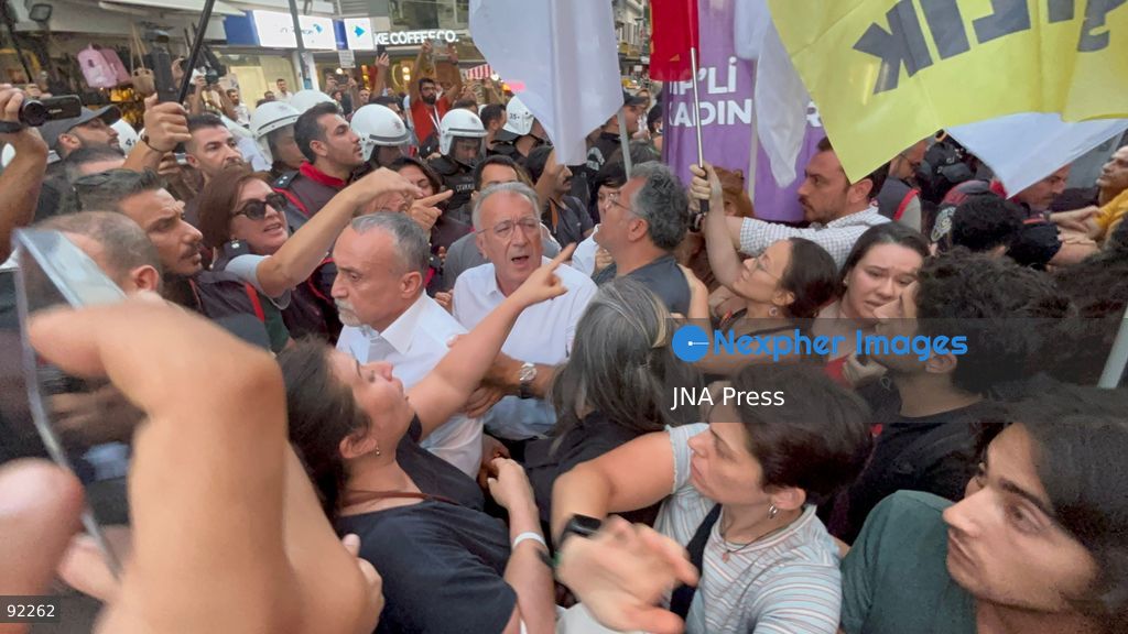 IZMIR, TURKEY, SEPTEMBER 14, 2026: Police intervene as demonstrators gather on Cyprus Martyrs Street in the Alsancak district of Izmir during a Feminist Night March in solidarity with LGBTI+ people. A scuffle broke out after police prevented demonstrators from unfurling a banner bearing the words “LGBTI+,” with officers using pepper spray to disperse the crowd. Two people were detained and several participants sustained minor injuries during the intervention, according to information provided by the photographer. Photo by Turgay Kilic / JNA Press. (Photo by Turgay Kilic/JNA Press via Nexpher Images)