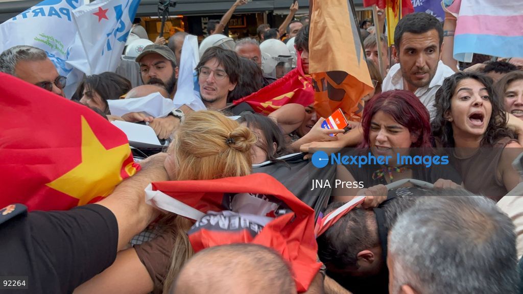 IZMIR, TURKEY, SEPTEMBER 14, 2026: Police intervene as demonstrators gather on Cyprus Martyrs Street in the Alsancak district of Izmir during a Feminist Night March in solidarity with LGBTI+ people. A scuffle broke out after police prevented demonstrators from unfurling a banner bearing the words “LGBTI+,” with officers using pepper spray to disperse the crowd. Two people were detained and several participants sustained minor injuries during the intervention, according to information provided by the photographer. Photo by Turgay Kilic / JNA Press. (Photo by Turgay Kilic/JNA Press via Nexpher Images)