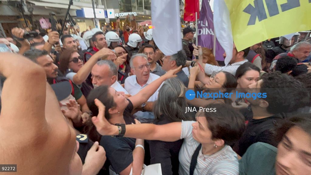 IZMIR, TURKEY, SEPTEMBER 14, 2026: Police intervene as demonstrators gather on Cyprus Martyrs Street in the Alsancak district of Izmir during a Feminist Night March in solidarity with LGBTI+ people. A scuffle broke out after police prevented demonstrators from unfurling a banner bearing the words “LGBTI+,” with officers using pepper spray to disperse the crowd. Two people were detained and several participants sustained minor injuries during the intervention, according to information provided by the photographer. Photo by Turgay Kilic / JNA Press. (Photo by Turgay Kilic/JNA Press via Nexpher Images)