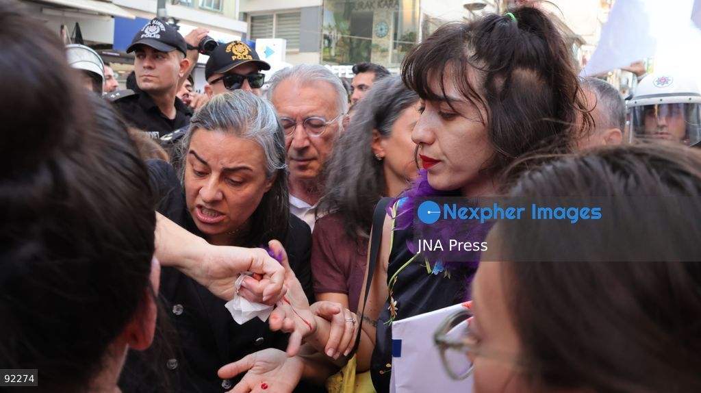 IZMIR, TURKEY, SEPTEMBER 14, 2026: Police intervene as demonstrators gather on Cyprus Martyrs Street in the Alsancak district of Izmir during a Feminist Night March in solidarity with LGBTI+ people. A scuffle broke out after police prevented demonstrators from unfurling a banner bearing the words “LGBTI+,” with officers using pepper spray to disperse the crowd. Two people were detained and several participants sustained minor injuries during the intervention, according to information provided by the photographer. Photo by Turgay Kilic / JNA Press. (Photo by Turgay Kilic/JNA Press via Nexpher Images)