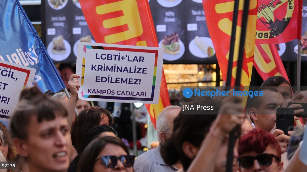 IZMIR, TURKEY, SEPTEMBER 14, 2026: Police intervene as demonstrators gather on Cyprus Martyrs Street in the Alsancak district of Izmir during a Feminist Night March in solidarity with LGBTI+ people. A scuffle broke out after police prevented demonstrators from unfurling a banner bearing the words “LGBTI+,” with officers using pepper spray to disperse the crowd. Two people were detained and several participants sustained minor injuries during the intervention, according to information provided by the photographer. Photo by Turgay Kilic / JNA Press. (Photo by Turgay Kilic/JNA Press via Nexpher Images)