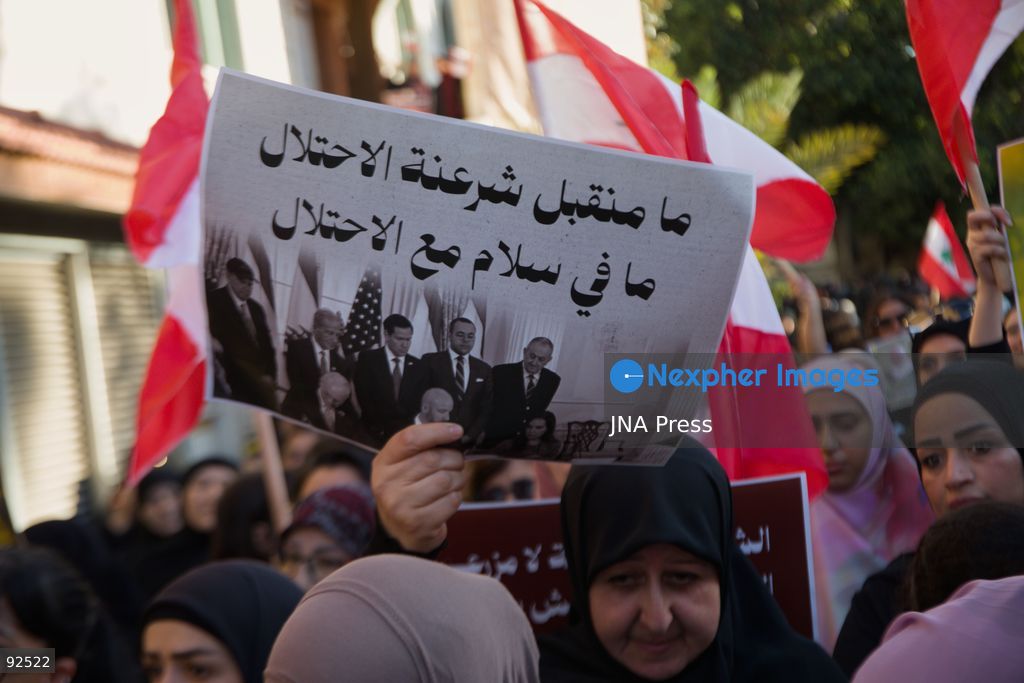 BEIRUT, LEBANON - Sept. 15: A woman holds a sign stating "We do not accept an Israeli occupation. There is no peace with occupation" during a protest on Sept. 15, 2026 in Beirut's southern suburbs over Israel's continued destruction of villages in south Lebanon. Photo by Nicholas Frakes / JNA Press (Photo by Nicholas Frakes/JNA Press via Nexpher Images)