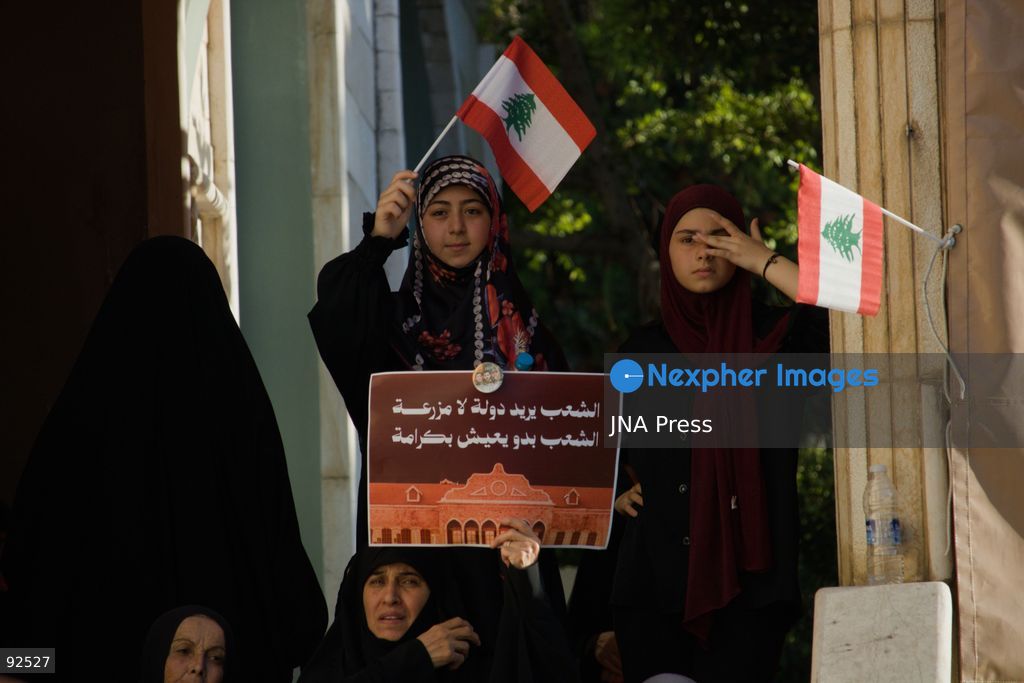 BEIRUT, LEBANON - Sept. 15: A young girl waves a Lebanese flag during a protest on Sept. 15, 2026 in Beirut's southern suburbs over Israel's continued destruction of villages in south Lebanon. Photo by Nicholas Frakes / JNA Press (Photo by Nicholas Frakes/JNA Press via Nexpher Images)