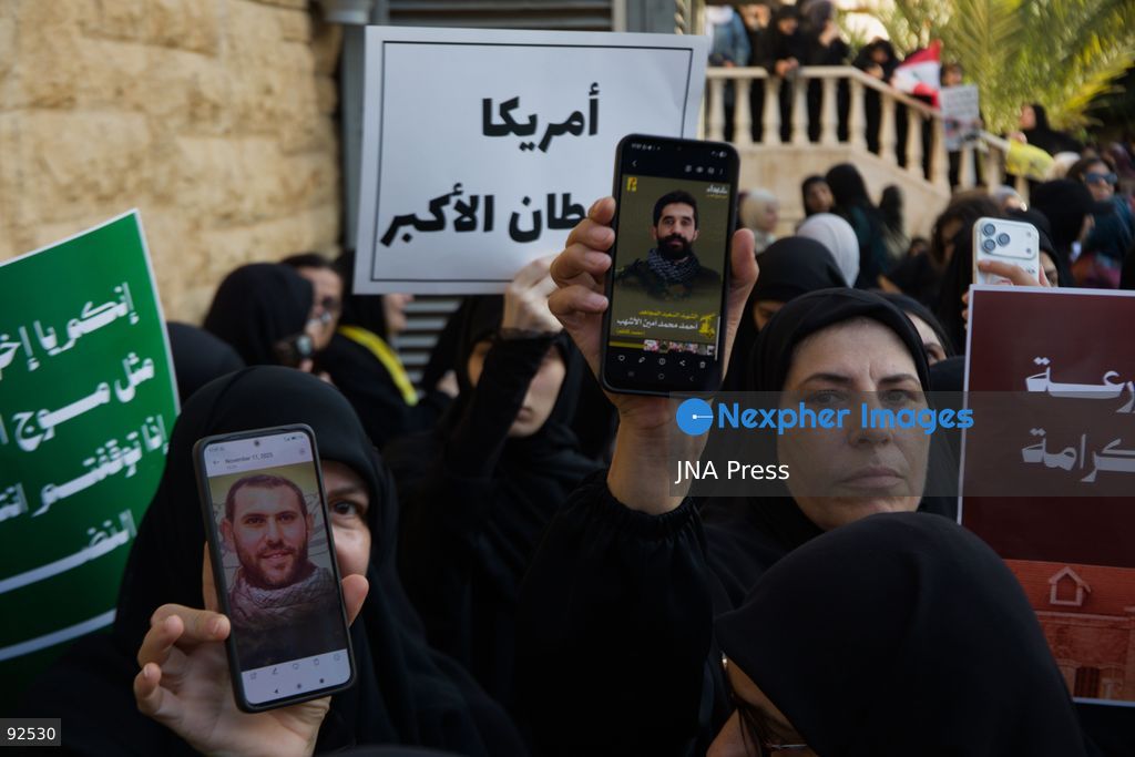 BEIRUT, LEBANON - Sept. 15: Women hold up pictures of slain Hezbollah members during a protest on Sept. 15, 2026 in Beirut's southern suburbs over Israel's continued destruction of villages in south Lebanon. Photo by Nicholas Frakes / JNA Press (Photo by Nicholas Frakes/JNA Press via Nexpher Images)
