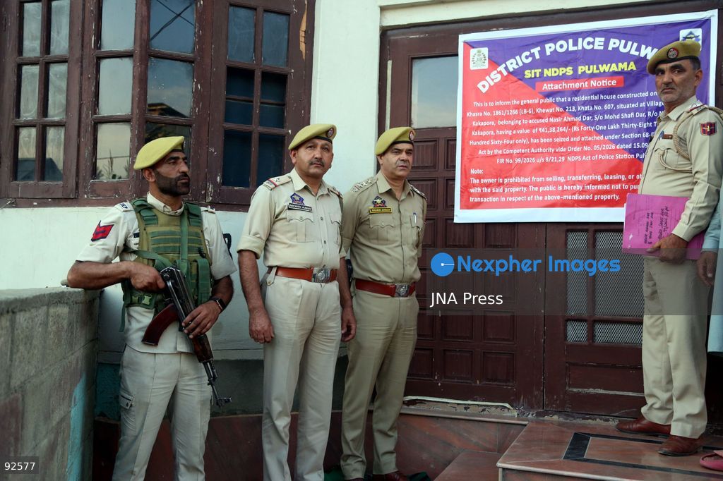 PULWAMA, INDIAN-ADMINISTERED KASHMIR, SEPTEMBER 15, 2026: Police personnel display an attachment notice on a residential property in New Colony, Kakapora, Pulwama district. Pulwama Police said the property, belonging to Nasir Ahmad Dar and valued at approximately 5.5 million Indian rupees, was attached under Section 68-F of India’s Narcotic Drugs and Psychotropic Substances (NDPS) Act in connection with a case registered under Sections 8/21 and 29 of the law. Photo by Nisar Ul Haq Allaie / JNA Press. (Photo by Nisar Ul Haq Allai/JNA Press via Nexpher Images)