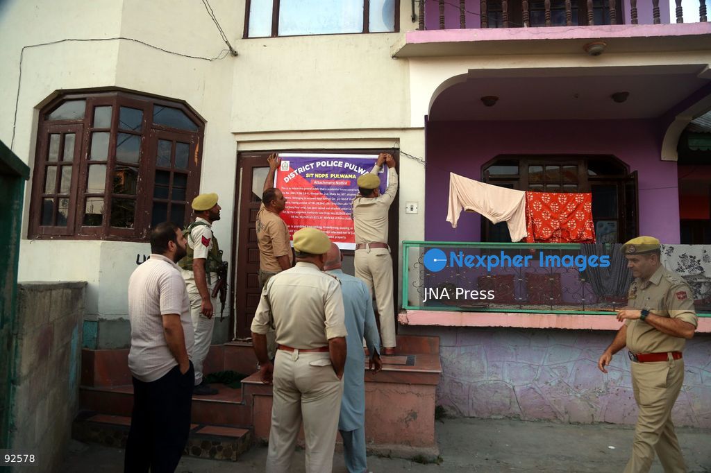 PULWAMA, INDIAN-ADMINISTERED KASHMIR, SEPTEMBER 15, 2026: Police personnel display an attachment notice on a residential property in New Colony, Kakapora, Pulwama district. Pulwama Police said the property, belonging to Nasir Ahmad Dar and valued at approximately 5.5 million Indian rupees, was attached under Section 68-F of India’s Narcotic Drugs and Psychotropic Substances (NDPS) Act in connection with a case registered under Sections 8/21 and 29 of the law. Photo by Nisar Ul Haq Allaie / JNA Press. (Photo by Nisar Ul Haq Allai/JNA Press via Nexpher Images)