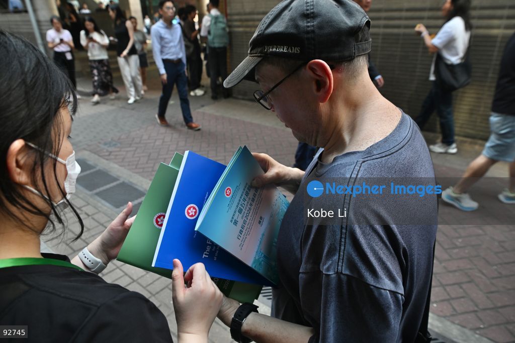 People getting the First Five-Year Plan for Economic and Social Development of the Hong Kong Special Administrative Region (2026-2030) and the Chief Executive's 2026 Policy Address on September 16, 2026 in Hong Kong. (Photo by Kobe Li/Nexpher Images)